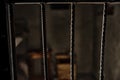 View of the empty prison cell through the bars Royalty Free Stock Photo