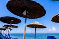 Umbrellas with loungers placed next to the coastline Royalty Free Stock Photo