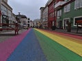 Smpty rainbow road, a shopping street in the center of Reykjavik, dedicated to Reykjavik Pride Gay Festival on cloudy winter day. Royalty Free Stock Photo