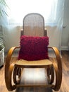 View on empty rocking chair in living room with shadow from backlight of window - grieve and loss of loved person concept