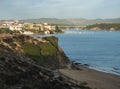 View of empty sand beach Praia do Farol and Vila Nova de Milfontes with Mira river, Forte de Milfontes, bridge and green Royalty Free Stock Photo