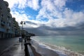 view of empty seaside promenade and sand beach in stormy autumn day Royalty Free Stock Photo