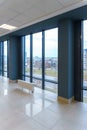 View of the empty spacious hall with large panoramic windows. Modern interior design of an empty office. A room with large windows Royalty Free Stock Photo