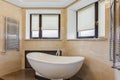 Stylish bathroom with rounded ceramic bath.