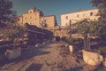 View of empty terrace of open-air cafe with tables and chairs in old town of Budva. Montenegro. Royalty Free Stock Photo