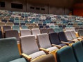 View of empty theater or cinema hall with empty rows of audience seats during the pandemic and lockdown with cancelled events