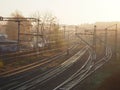 View of the empty trackway with railway tracks during sunrise with fog during summer in Przemysl