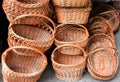 View of empty wooden brown baskets placed on top of each other on a grey surface