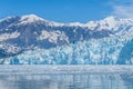 A view of the end of the snout of the Hubbard Glacier with mountain backdrop in Alaska Royalty Free Stock Photo