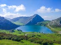 View of Enol Lake in Covadonga Lakes, Asturias, Spain, from the lookout. Green grassland with mountains at the background Royalty Free Stock Photo