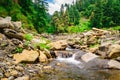 View enroute to Prashar Lake trekk trail through small waterfall rivulet. It is located at a height of 2730 m above sea level