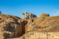 View of the entrances to the arena of the Roman Amphitheater of Merida and the stage of the columned Roman theater behind Royalty Free Stock Photo