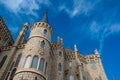 Detail view of Episcopal palace in Astorga, landmark of architect Antoni Gaudi, with tower against clear blue sky