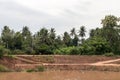 View of the eroded riverbank road. Royalty Free Stock Photo