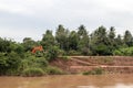 View of the eroded riverbank road. Royalty Free Stock Photo