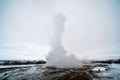 View of an erupting geyser. Winter in Iceland