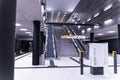 View of the escalator and black columns of Berlin subway station.