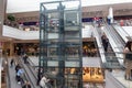 View on escalator in modern shopping mall Triniti