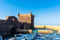 View of Essaouira port with blue fishing boats, Essaouira, Morocco. Copy space for text