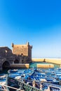 View of Essaouira port with blue fishing boats, Essaouira, Morocco. Vertical. Copy space for text