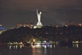 View of the evening city of Kiev, Ukraine, the Dnieper River. Monument Mother Motherland.