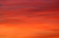 Orange, red, pink color shades on clouds at sunset