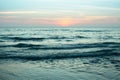 View of evening surf of the sea during sunset. Royalty Free Stock Photo