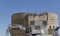 Excavator demolishing a building