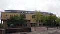 a view of exchange square in bradford west yorkshire with the crown court building surrounded by trees