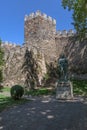 View at the exterior fortress tower at Castle of Braganca, and statue at D. Fernando, outside in the garden