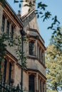 Exterior of the Meadow Building, Christ Church College in Oxford, UK, through the tree branches