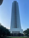 a view of the exterior of a tall building in a field Royalty Free Stock Photo