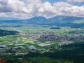 View of extinct volcanoes with village near foothills.