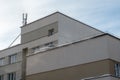 View of the facade of a modern concrete building or office center. The roofs of the buildings are covered with snow and ice after Royalty Free Stock Photo