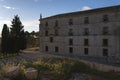 A view of the facade of the Monastery of UclÃÂ©s at sunset, Cuenca, Spain Royalty Free Stock Photo