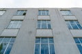 View of the facade of an office building with large Windows. New wide double glazed windows installed in a modern building