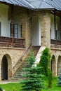 view of the facade of an old house with a porch and arches Royalty Free Stock Photo