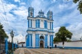 View of the facade of the Saint Lucia Church, painted in white and blue, in the city of San Cristobal de Las Casas