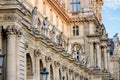 Facade of the famous musseum The Louvre in the city center of Paris.