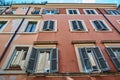 A view of facade of traditional picturesque roman apartment building on the streets of Rome, Italy