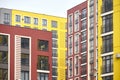 View of the facades of multi-colored multi-storey residential buildings. Fragment of a multi-storey residential building Royalty Free Stock Photo