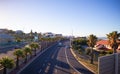 View facing the city from bridge over Nelson Mandela Boulevard. Warm sunset over town. Royalty Free Stock Photo
