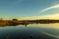 Fall colors in a park with reflections in the lake in Omaha Nebraska Royalty Free Stock Photo