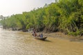 View of a family boat sailing on the Rupsa River - Bangladesh