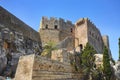 View on famous antique greek temple ruins on the rock on Greece island Rhodes in Lindos city and walking tourists. Famous sightse