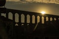 View of the famous Aqueduct of Segovia at Sunset. Royalty Free Stock Photo