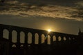 View of the famous Aqueduct of Segovia at Sunset.