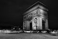 View of famous Arc de Triomphe in Charles de Gaulle square at night in Paris, France Royalty Free Stock Photo