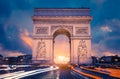 View of famous Arc de Triomphe at sunset