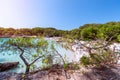 View of the famous beach Cala Turqueta. Focus on foreground, people on the beach in blur. Menorca, Balearic islands, Spain Royalty Free Stock Photo